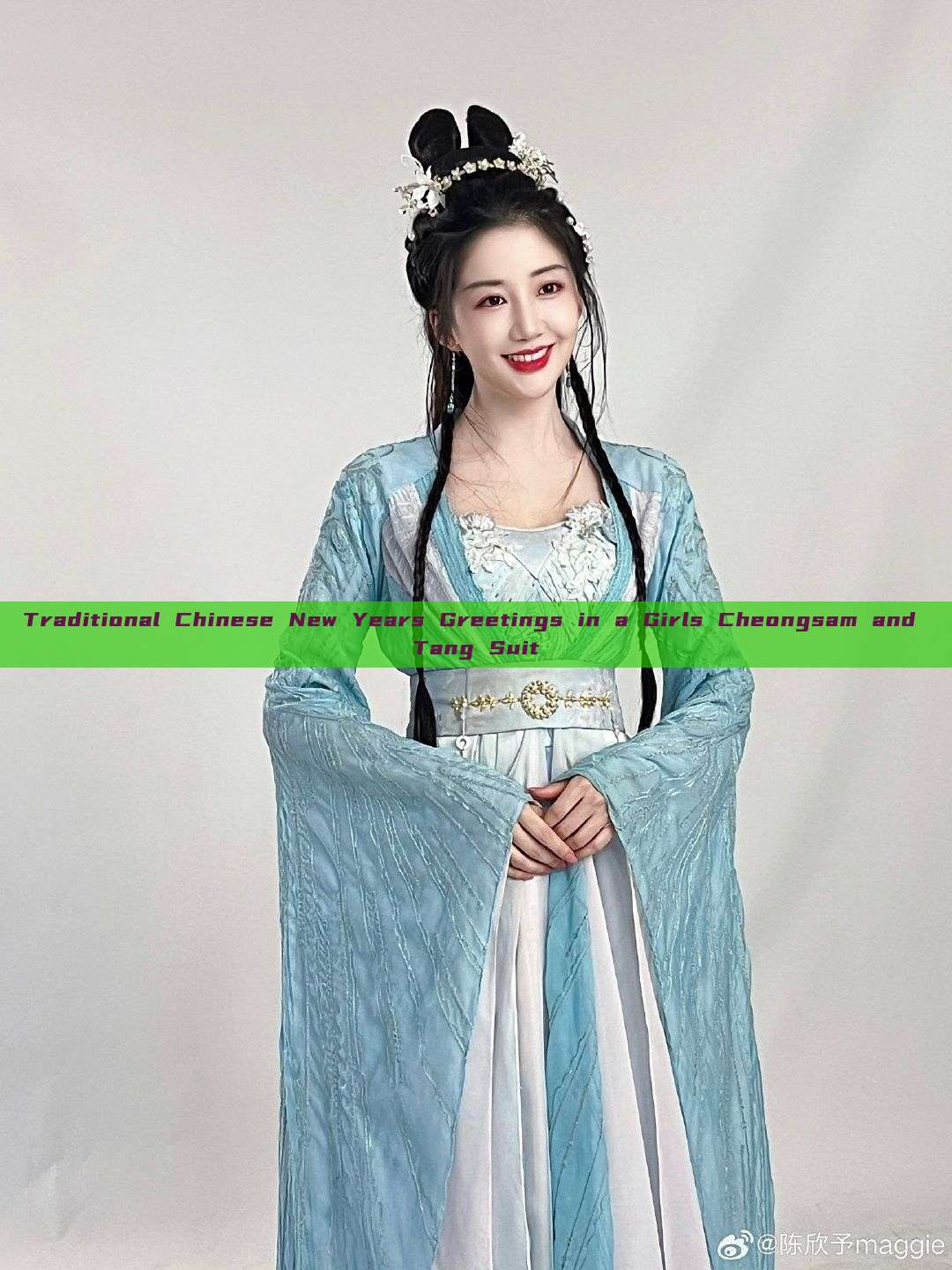 Traditional Chinese New Years Greetings in a Girls Cheongsam and Tang Suit Traditional Chinese New Years Greetings in a Girls Cheongsam and Tang Suit