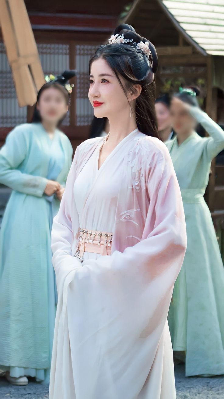 The Enchantment of Traditional Chinese Cheongsam in a Blush Pink Hue The Enchantment of Traditional Chinese Cheongsam in a Blush Pink Hue